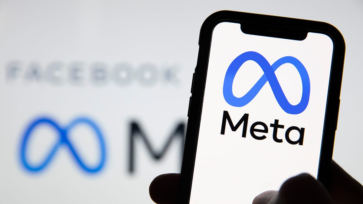 A photo of a meta logo on a mobile phone